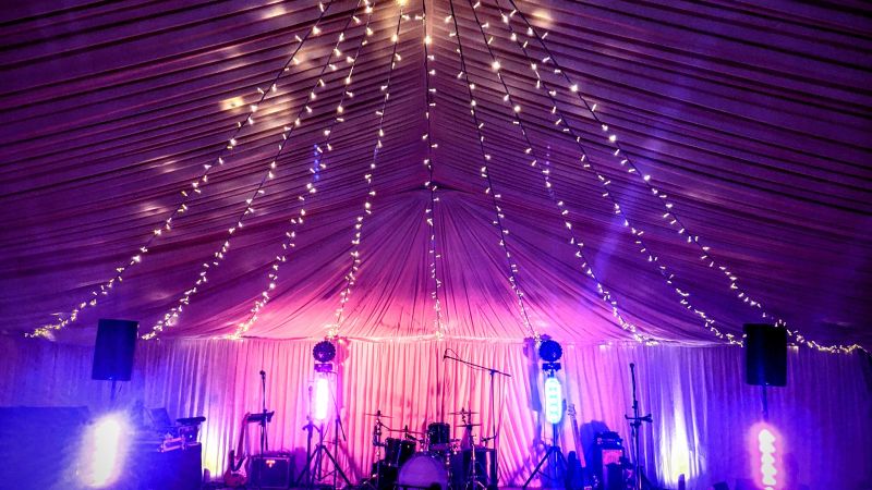 AKA wedding band set up at private marquee with fairy lights - Live Wedding Band | Hire a wedding band | live wedding bands | Live music wedding bands | best wedding live bands | AKA Party Band