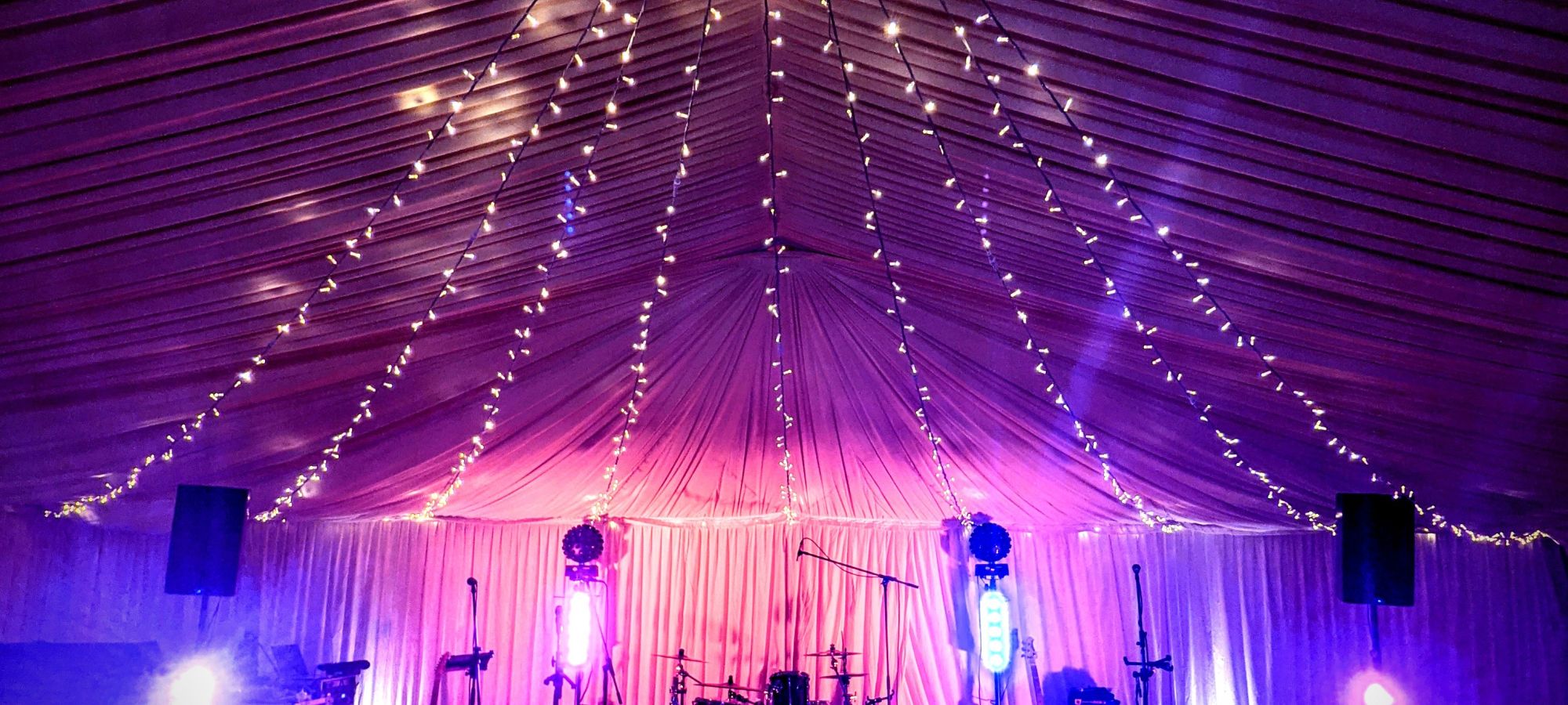 AKA wedding band set up at private marquee with fairy lights - Live Wedding Band | Hire a wedding band | live wedding bands | Live music wedding bands | best wedding live bands | AKA Party Band