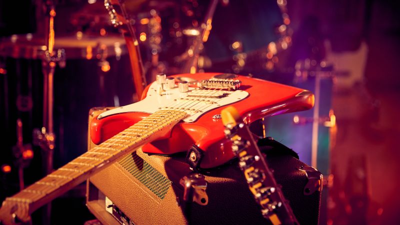 Electric Guitar resting on amplifier - Live Wedding Band | How to book a wedding band | live bands for wedding | Live band wedding cost | how much is a live band for a wedding | AKA Party Band