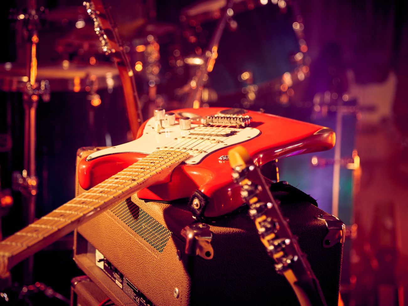 Electric Guitar resting on amplifier - Live Wedding Band | How to book a wedding band | live bands for wedding | Live band wedding cost | how much is a live band for a wedding | AKA Party Band