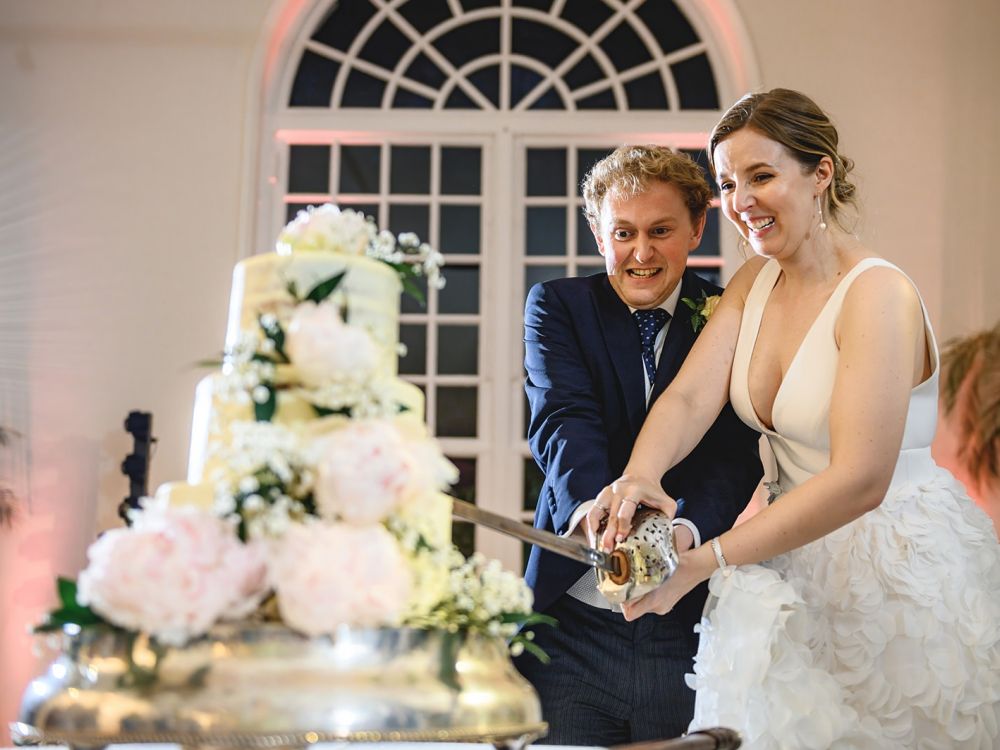 Bride and Groom Cutting Their Cake at Kew Gardens Emmie Scott Photo