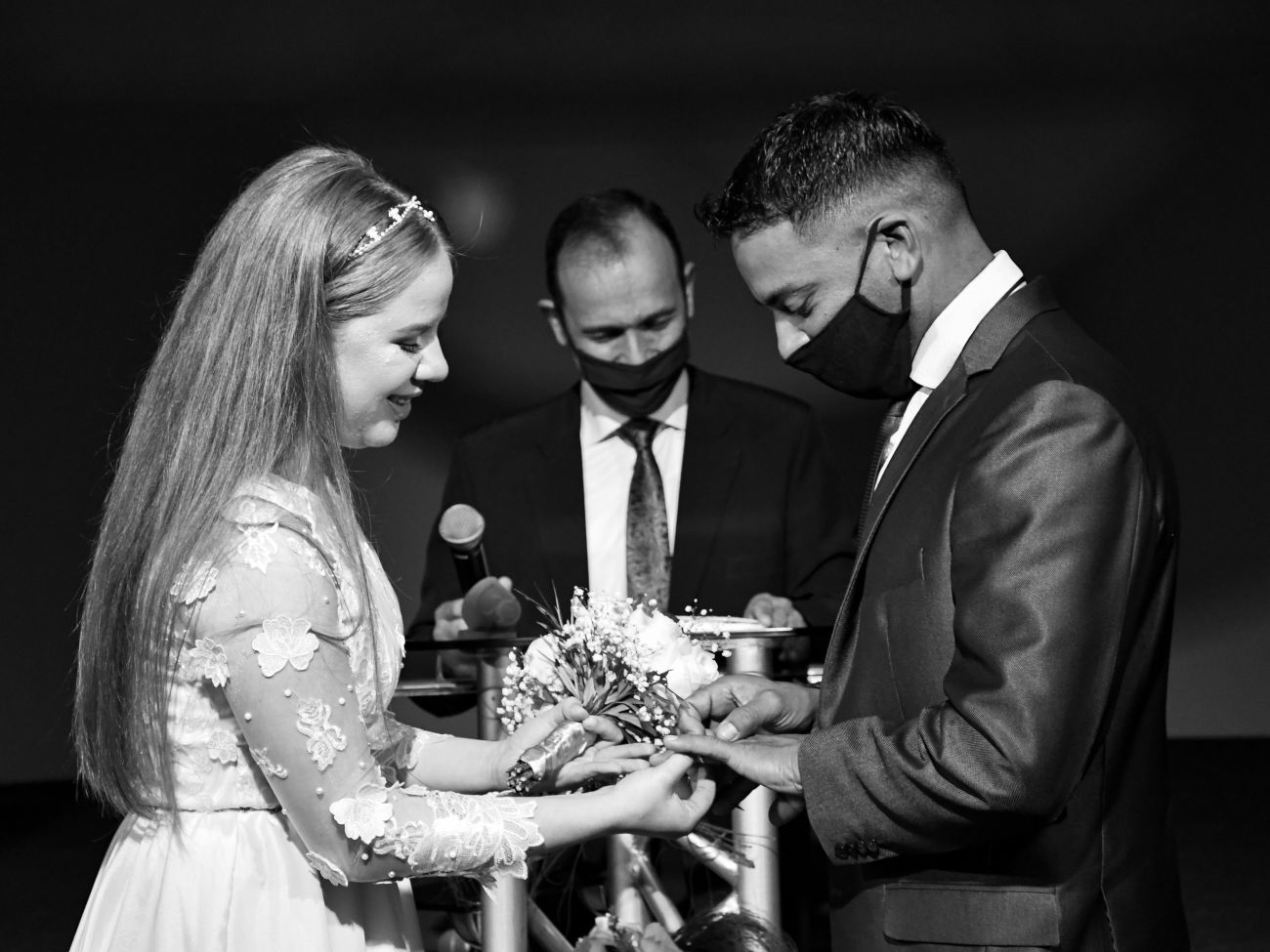 Covid bride and groom at the alter sharing rings before parting away with the live band in the evening - Live Wedding Band | Surrey wedding entertainment | live band for wedding | Live band for wedding reception | AKA Party Band