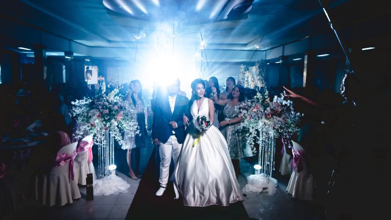 Contemporary bride and groom walking down the aisle in their pastel themed wedding - Live Wedding Band | Hire a wedding band | live wedding bands | Live music wedding bands | best wedding live bands | AKA Party Band