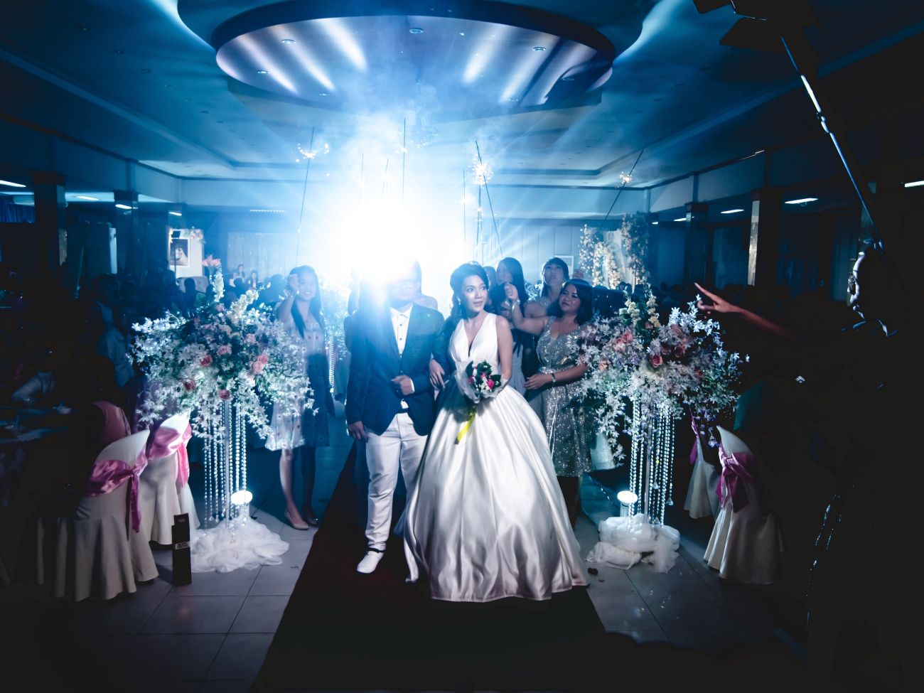 Contemporary bride and groom walking down the aisle in their pastel themed wedding - Live Wedding Band | Hire a wedding band | live wedding bands | Live music wedding bands | best wedding live bands | AKA Party Band