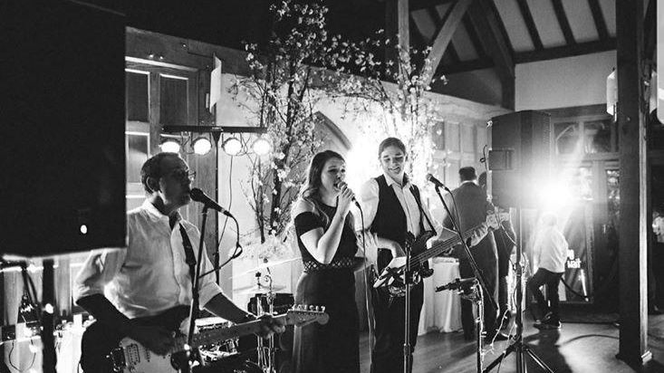 Black and White Photo of AKA performing best wedding live band - Live Wedding Band | Surrey wedding entertainment | live band for wedding | Live band for wedding reception | AKA Party Band